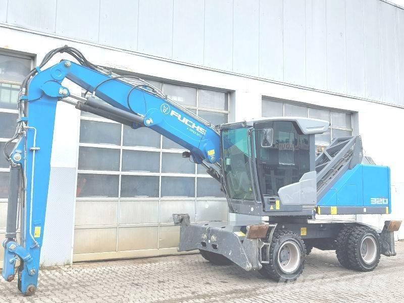 Fuchs MHL 320 F Paleta de manipulare