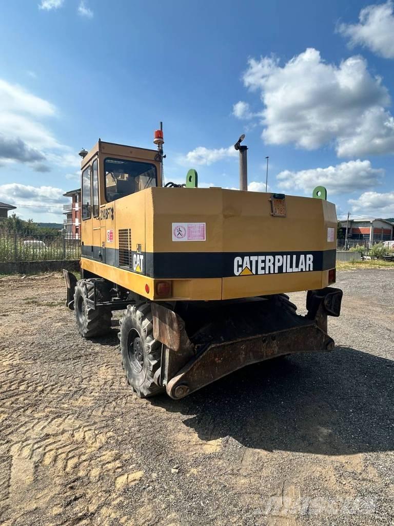 CAT 214 Excavatoare cu roti
