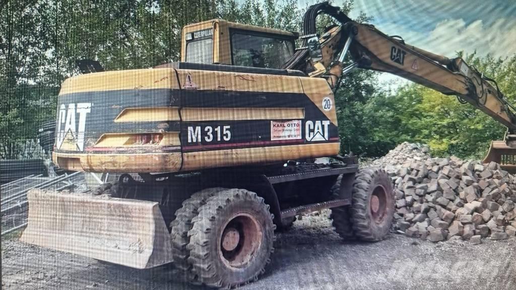 CAT M 315 Excavatoare cu roti