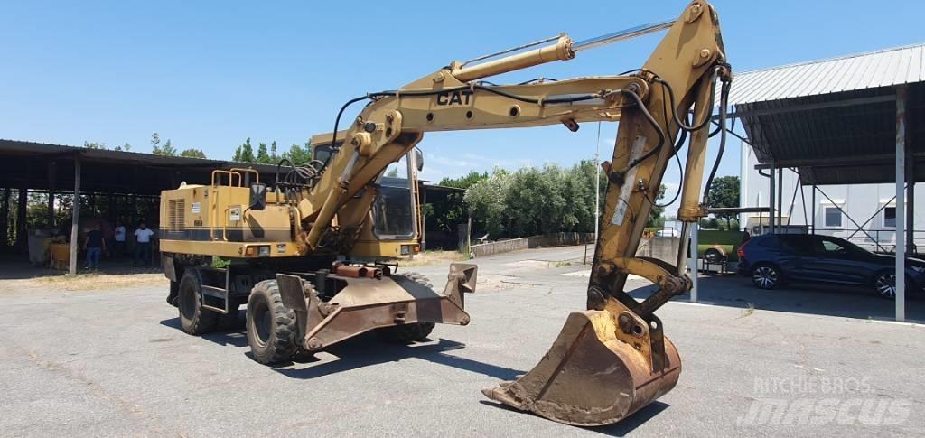 CAT 214 B Excavatoare cu roti