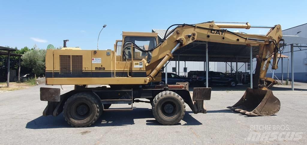 CAT 214 B Excavatoare cu roti