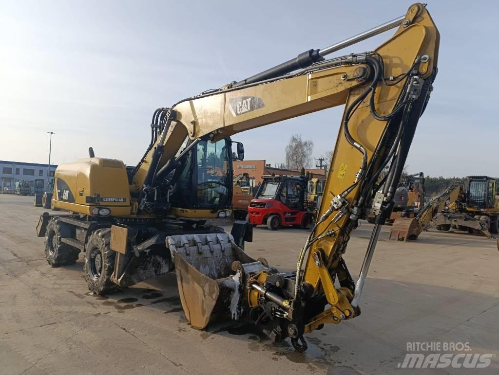 CAT M 313 D Excavatoare cu roti