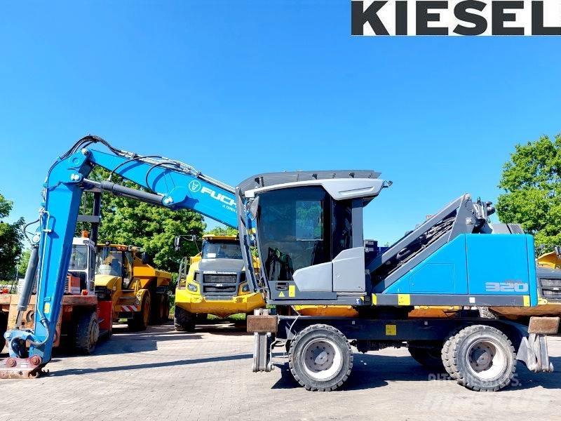 Fuchs MHL 320 F Paleta de manipulare