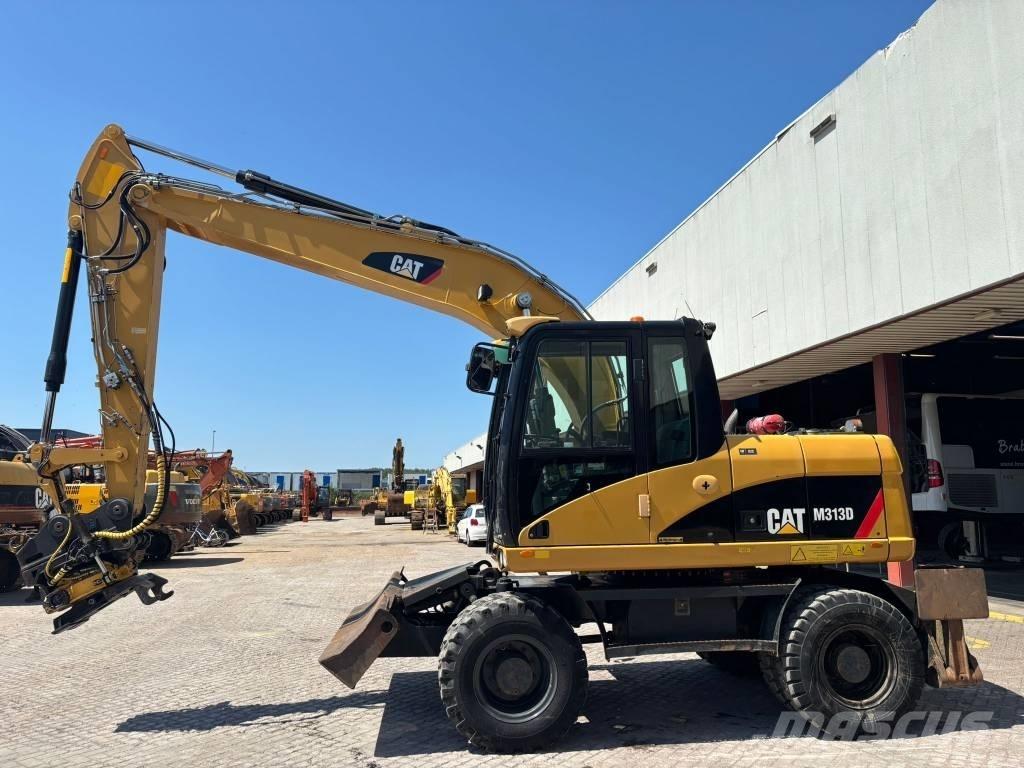 CAT M 313 D Excavatoare cu roti