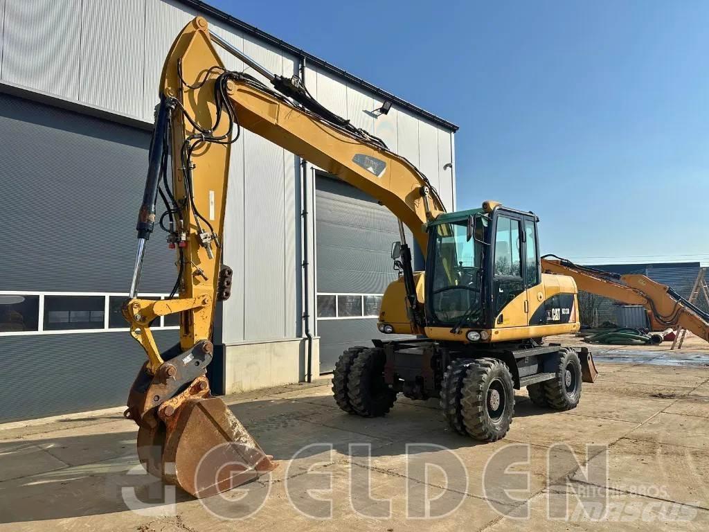CAT M313D Excavatoare cu roti