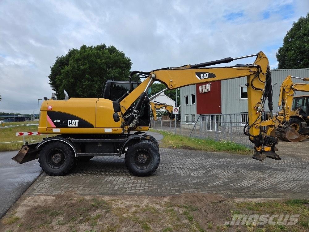 CAT M313D Excavatoare cu roti