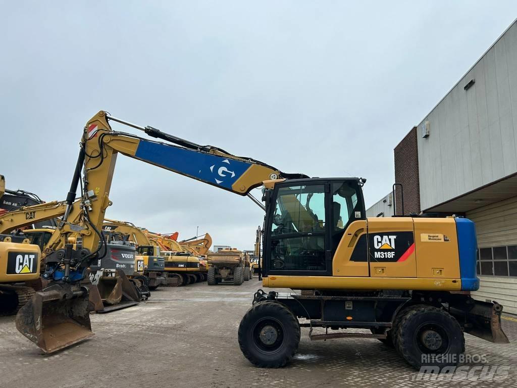CAT M 318 F Excavatoare cu roti