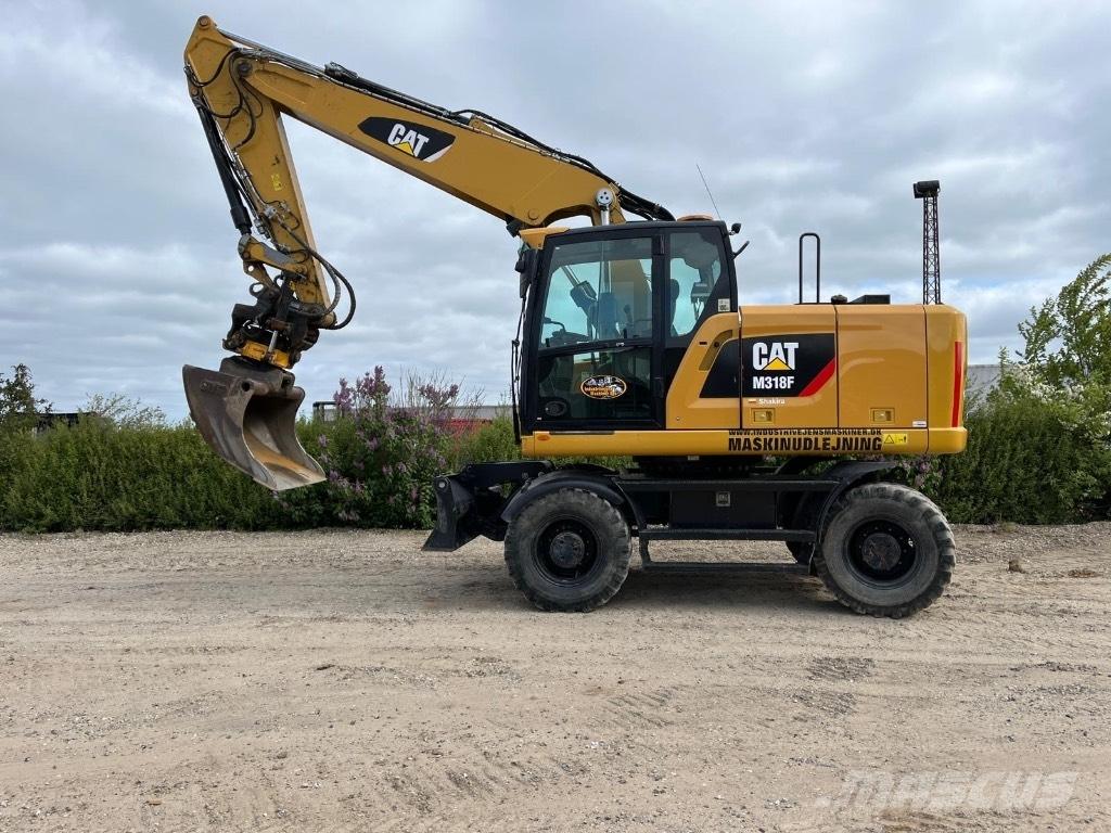CAT M 318 F Excavatoare cu roti