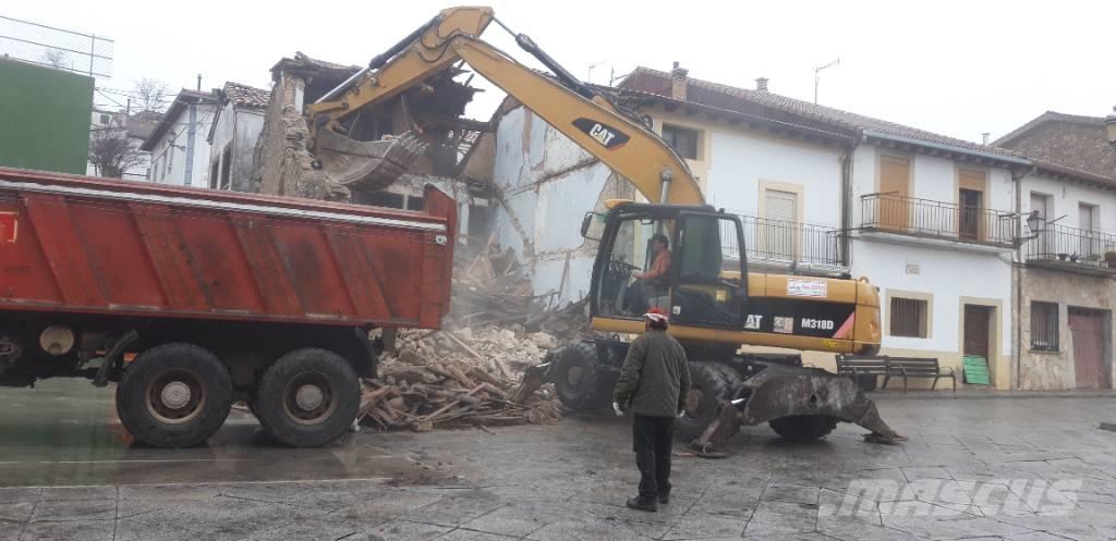 CAT M318d Excavatoare cu roti