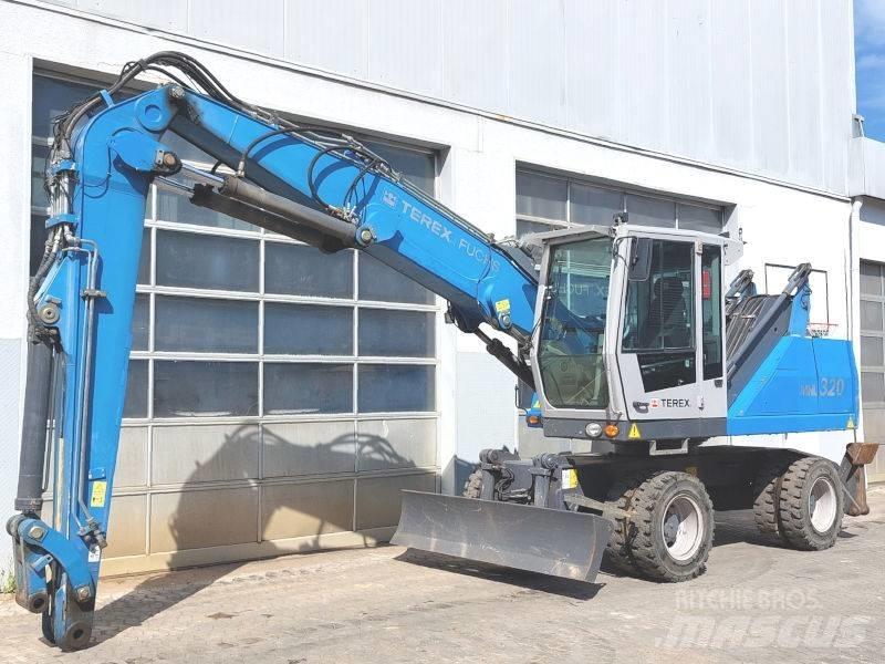 Fuchs MHL 320 D Paleta de manipulare