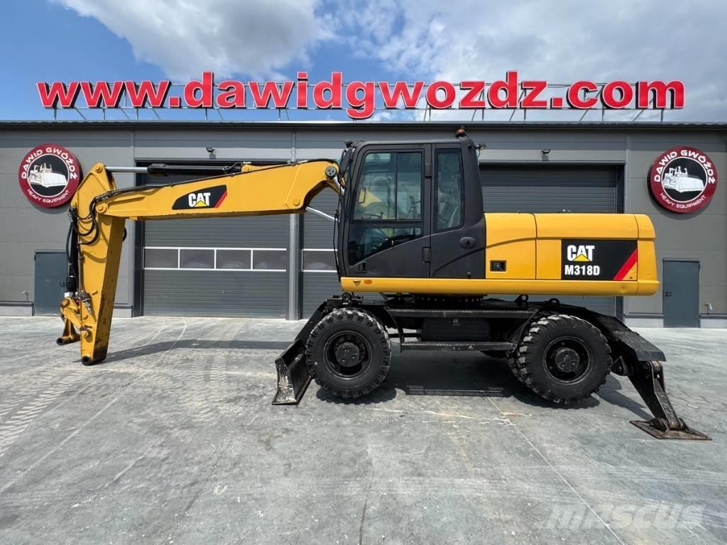 CAT M 318 D Excavatoare cu roti