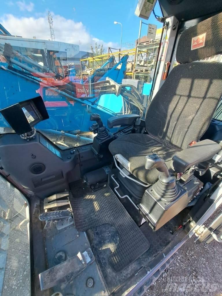Fuchs MHL 320 Paleta de manipulare