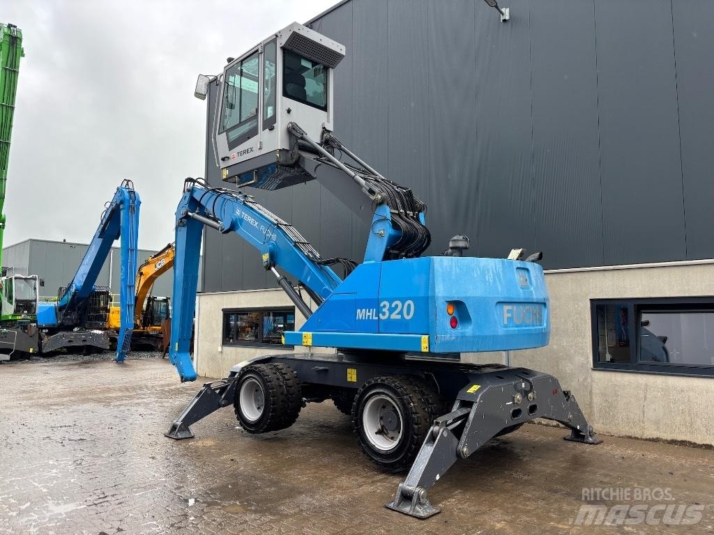 Fuchs MHL 320 D Paleta de manipulare