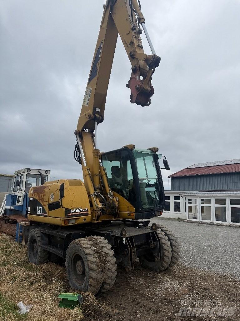 CAT M 313 C Excavatoare cu roti