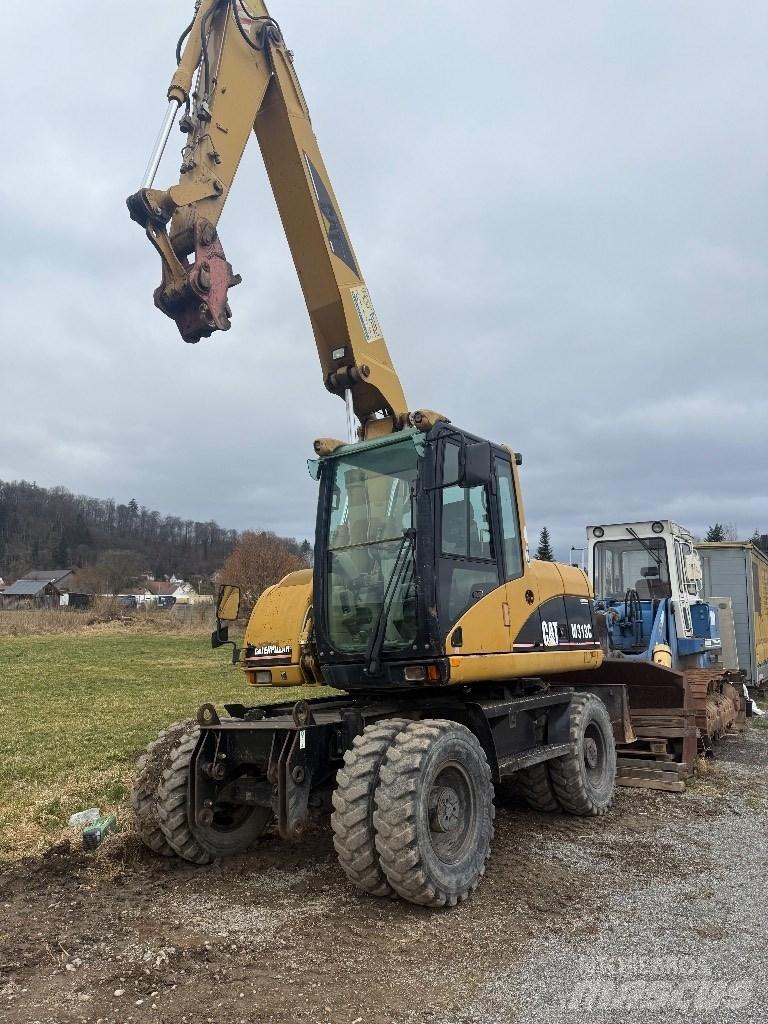 CAT M 313 C Excavatoare cu roti