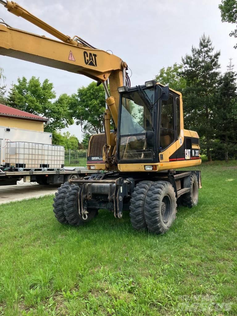 CAT M 312 Excavatoare cu roti