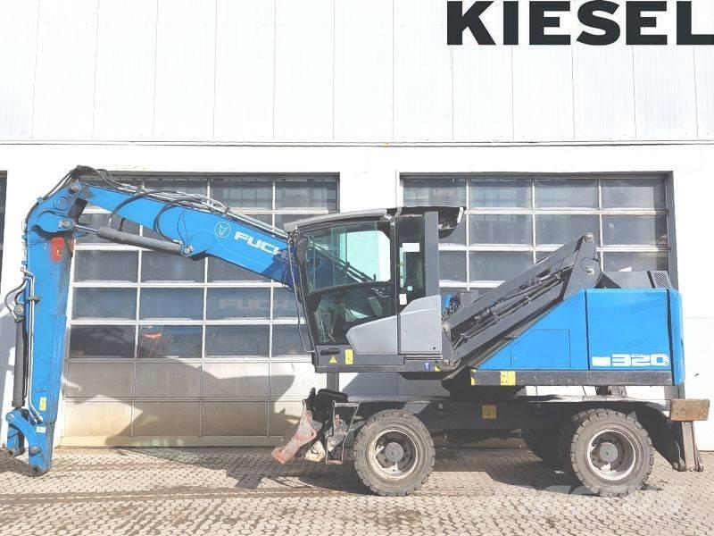 Fuchs MHL 320 F Paleta de manipulare
