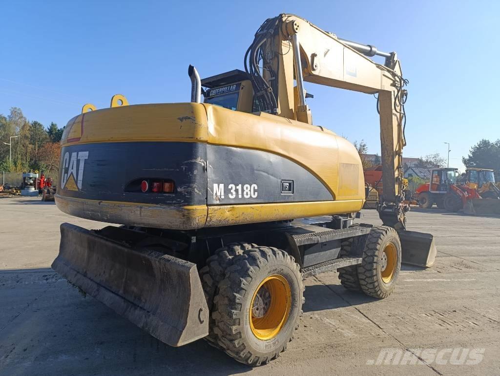 CAT M 318 C Excavatoare cu roti