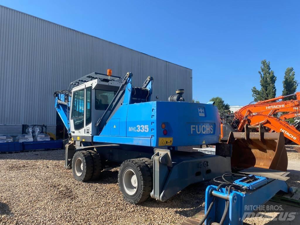 Fuchs MHL 335 Paleta de manipulare