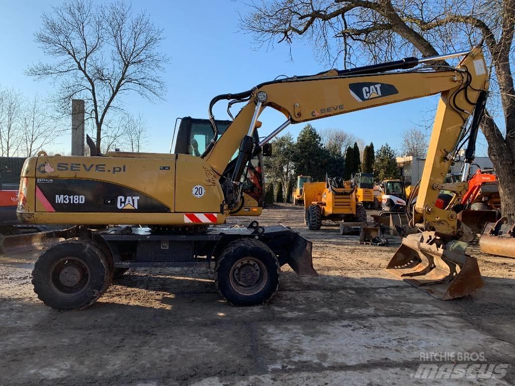 CAT M 318 D Excavatoare cu roti