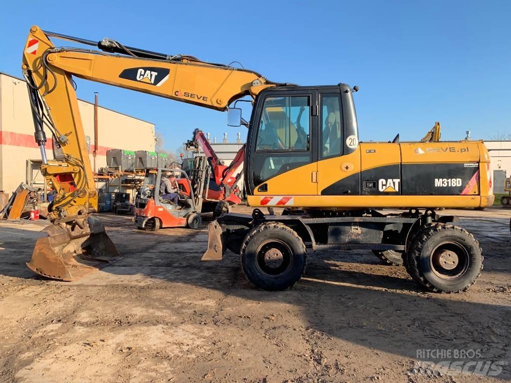 CAT M 318 D Excavatoare cu roti