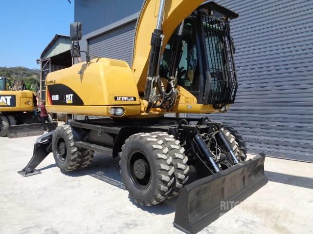 CAT M 318 D Excavatoare cu roti
