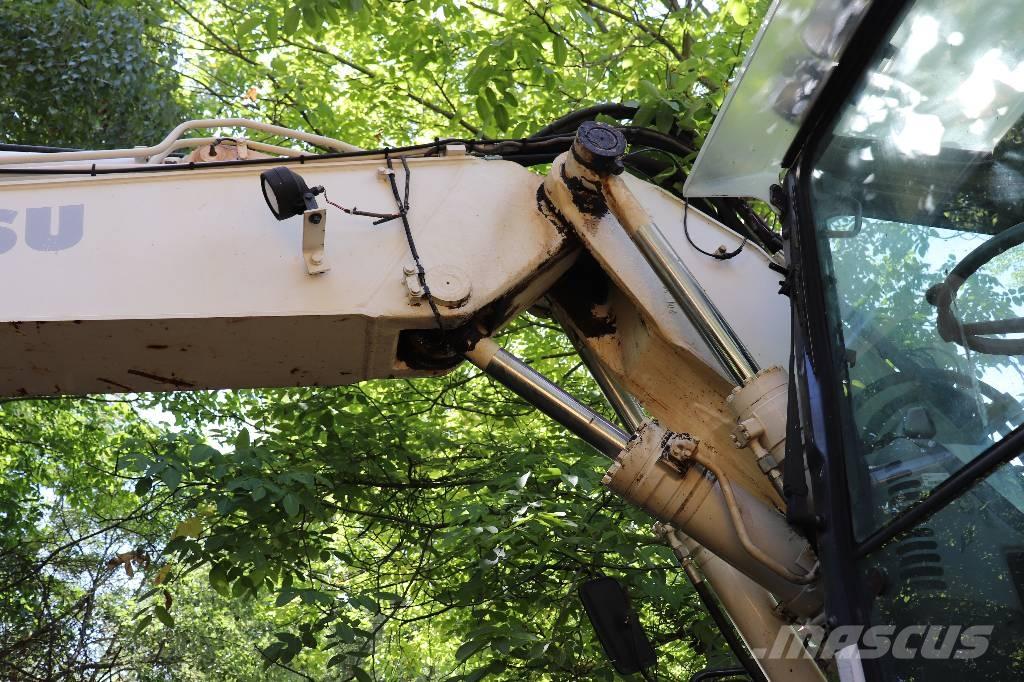 Komatsu PW 140-7 Buldoexcavatoare