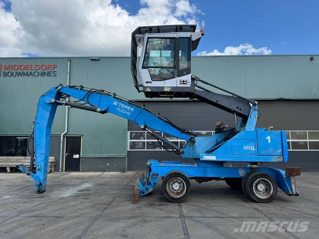 Fuchs MHL 320 Paleta de manipulare