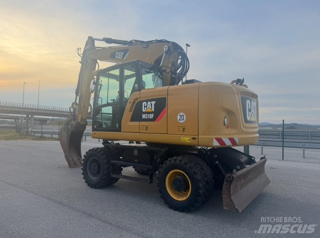 CAT M 318 F Excavatoare cu roti