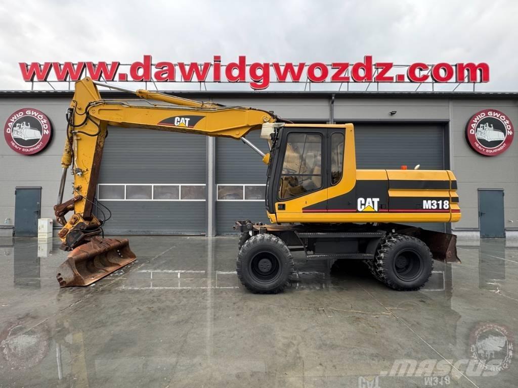 CAT M 318 Excavatoare cu roti
