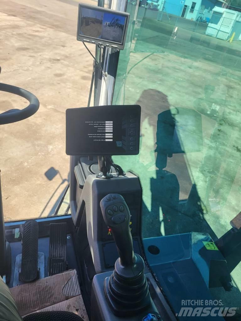 Fuchs MHL 331 Paleta de manipulare