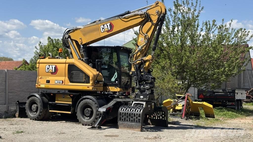 CAT M 319 Excavatoare cu roti