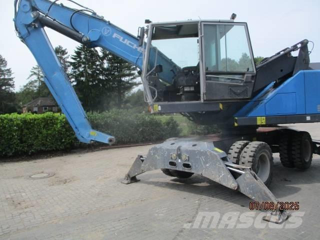 Fuchs MHL 320 Paleta de manipulare