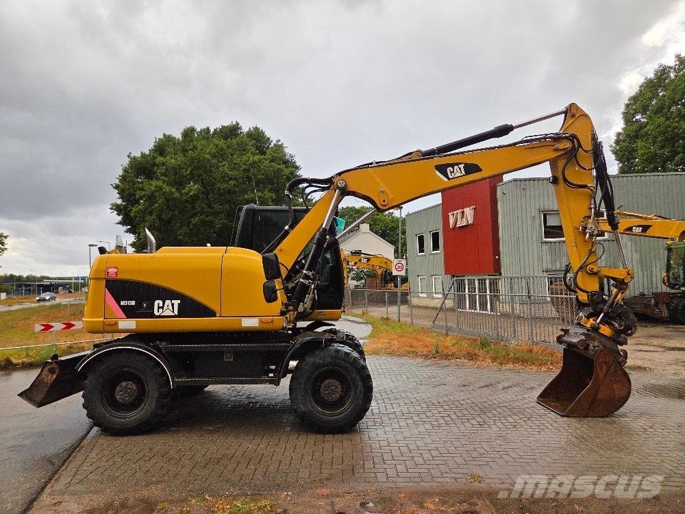 CAT M313D Excavatoare cu roti