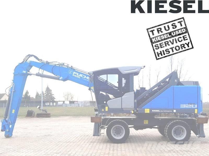 Fuchs MHL 320 F Paleta de manipulare