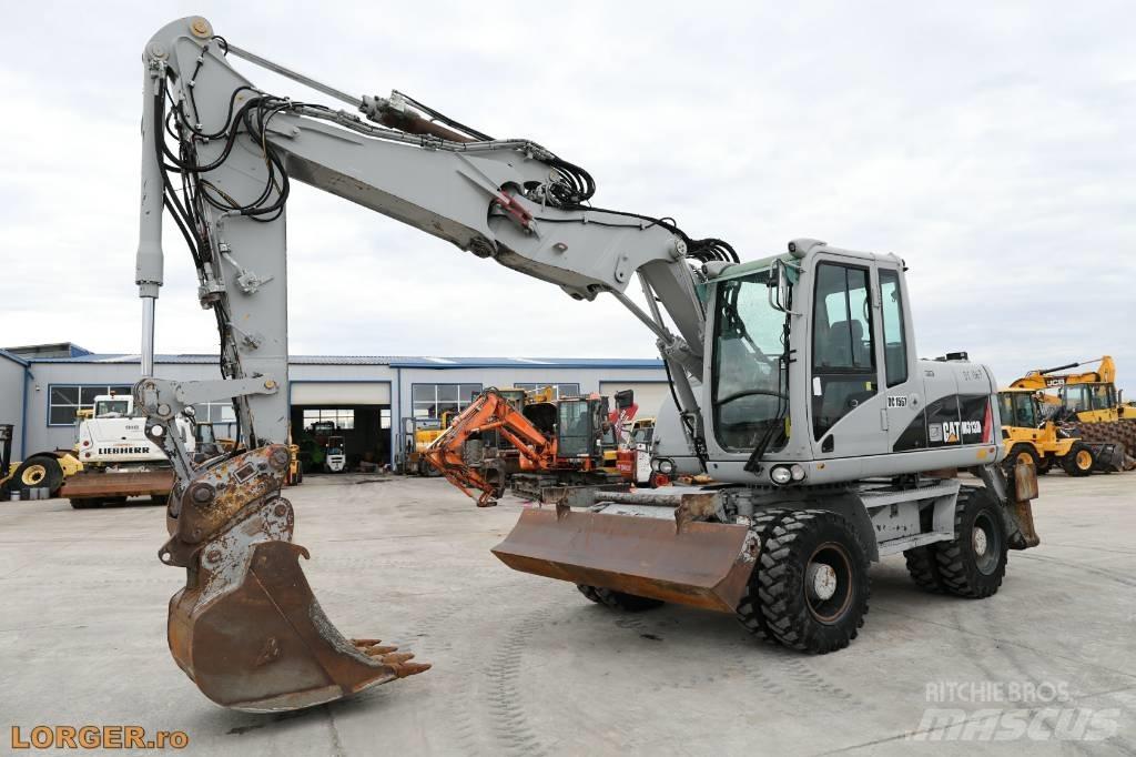 CAT M 313 D Excavatoare cu roti