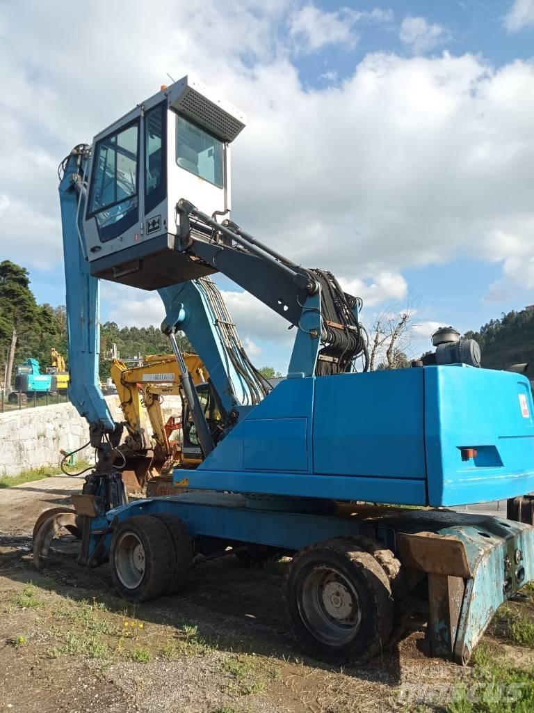 Fuchs MHL 331 Paleta de manipulare