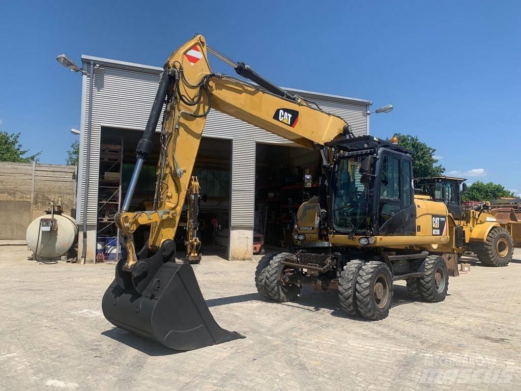 CAT M 318 D Excavatoare cu roti