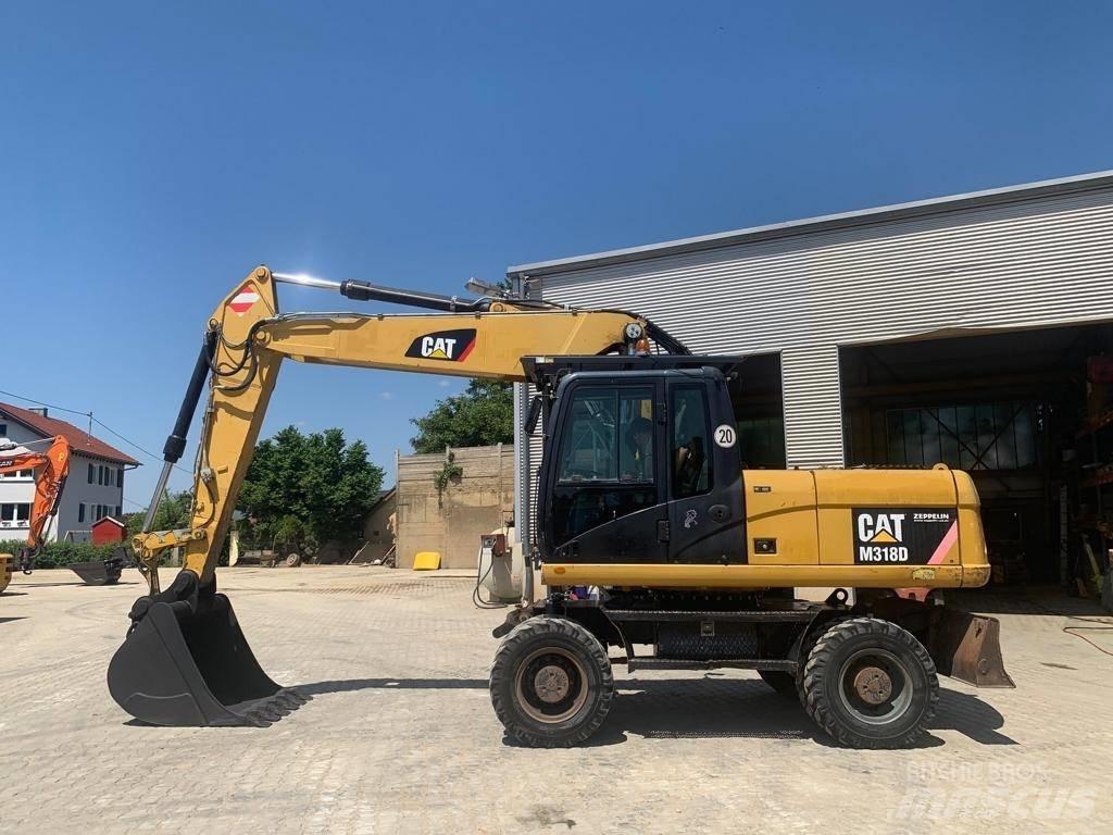 CAT M 318 D Excavatoare cu roti