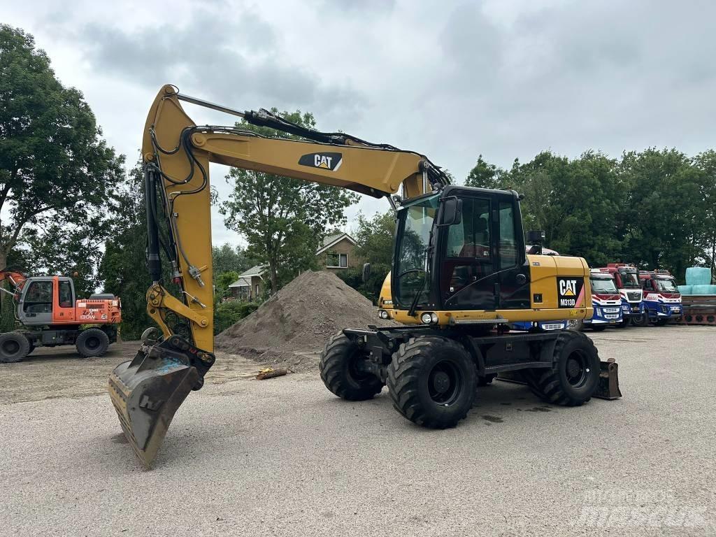 CAT M 313 D Excavatoare cu roti