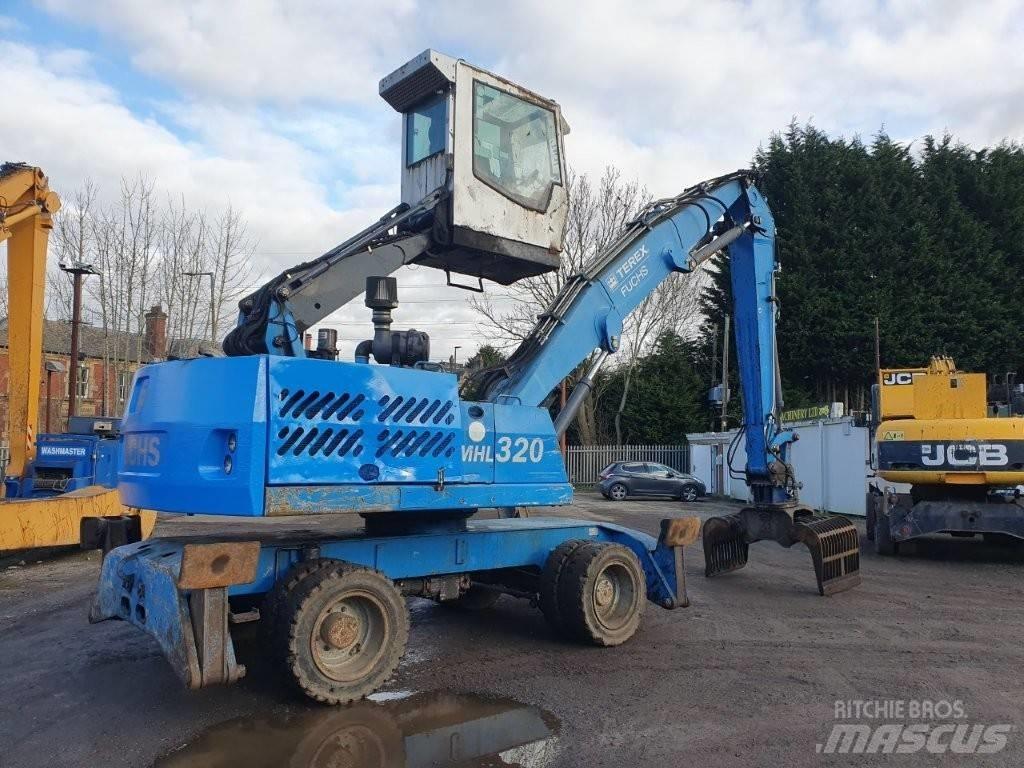 Fuchs MHL 320 Paleta de manipulare
