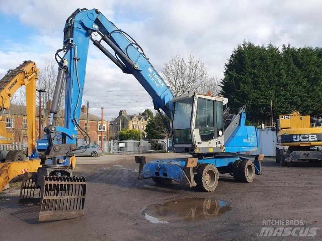 Fuchs MHL 320 Paleta de manipulare
