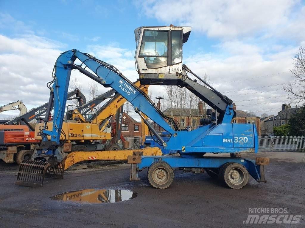 Fuchs MHL 320 Paleta de manipulare