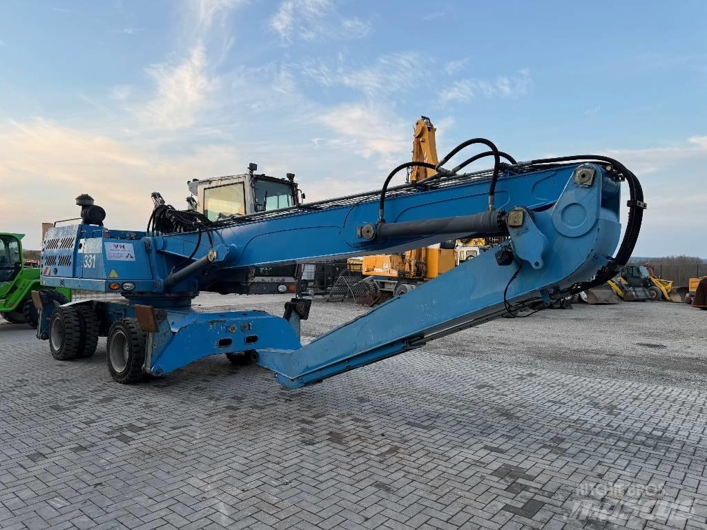 Fuchs MHL 331 Paleta de manipulare