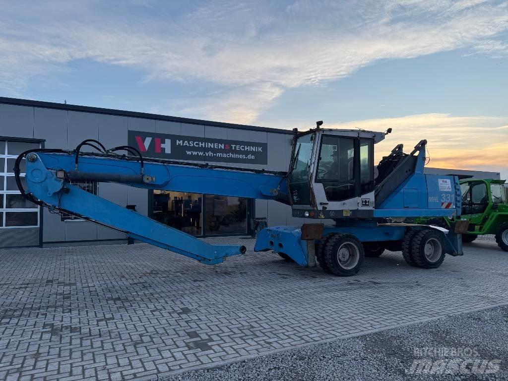 Fuchs MHL 331 Paleta de manipulare