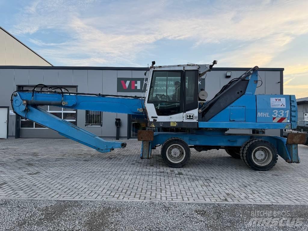Fuchs MHL 331 Paleta de manipulare