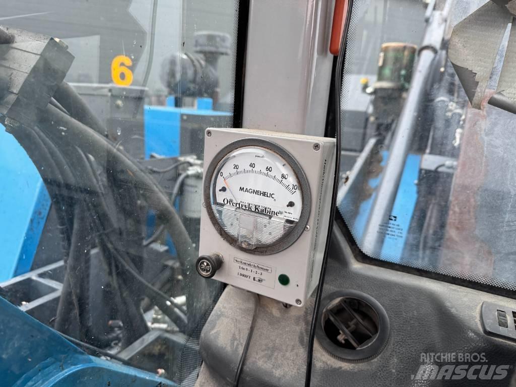 Fuchs MHL 320 Paleta de manipulare