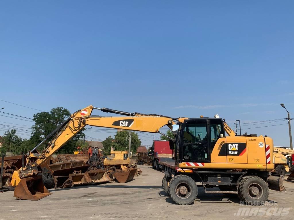 CAT M 318 F Excavatoare cu roti
