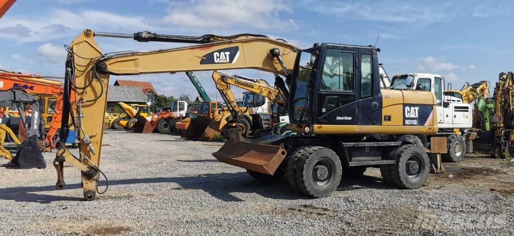 CAT M 315 D Excavatoare cu roti