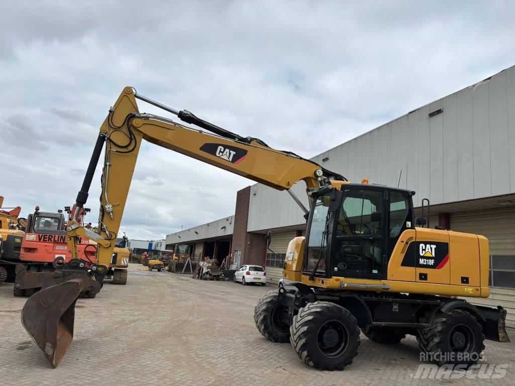 CAT M 318 F Excavatoare cu roti
